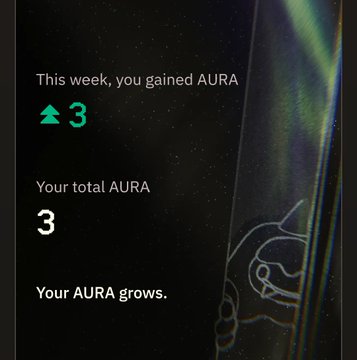 A dark screen with green accents displaying 'This week, you gained AURA ▲ 3', 'Your total AURA 3', and 'Your AURA grows.'