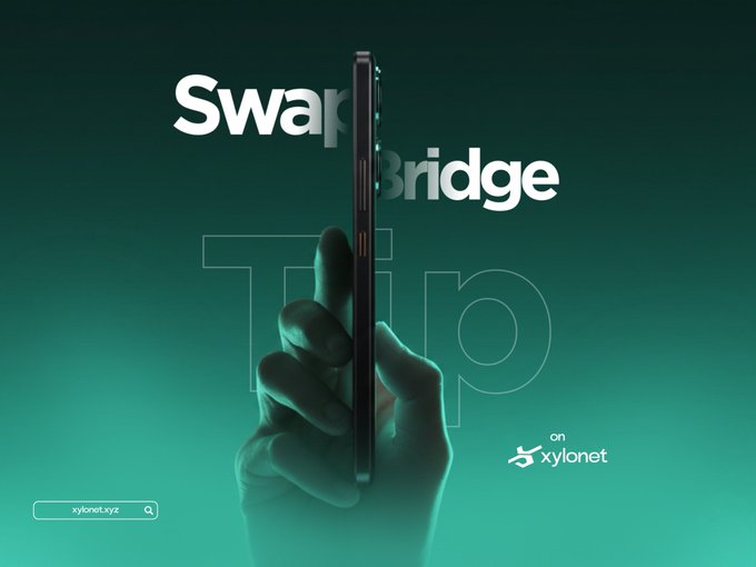 An advertisement showing a hand holding a smartphone edge-on, with the text 'Swap Bridge' and 'Trip' overlaid on a teal gradient background, promoting xylonet.xyz.