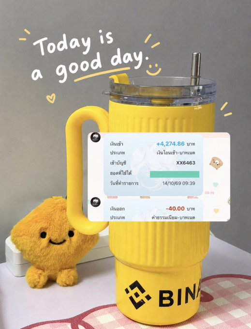 A cheerful yellow Binance tumbler displays a transaction notification showing a +4,274.86 THB crypto deposit (XX6463) on 14/10/69, paired with a cute plush mascot and the handwritten note "Today is a good day," perfectly matching the post's theme of finding simple joy in crypto gains while enjoying a refreshing drink.
