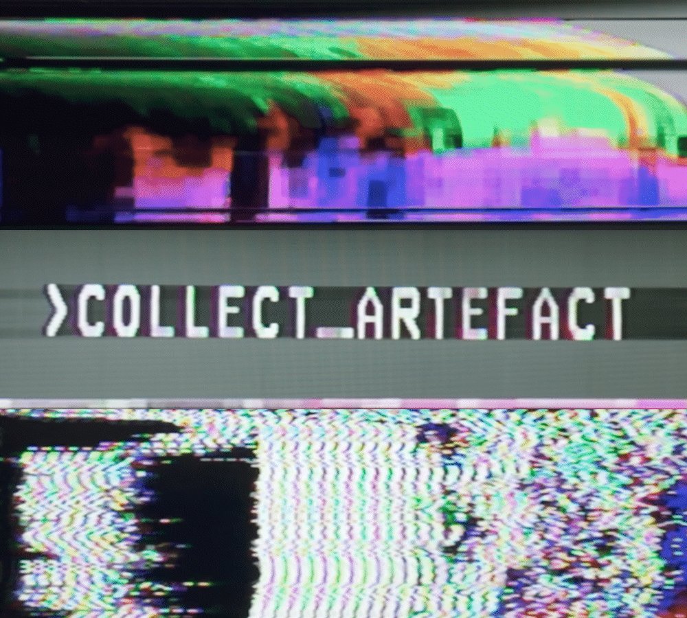 The image shows a digital photo with distorted colors, resembling an analog video that has been played backwards or scrambled. The image also contains the text "CollectArtefact" in the top left corner of the frame. It appears that someone is trying to recover a lost piece of information by manually going through the blurry or jumbled content, as suggested by the post's context: "The visual corruption is unparseable: flagged forever as FILE_UNREAD. Only human eyes can decrypt what the analog gear left behind. You are running manual data recovery on the ghost of the internet. Extract the signal. Hold the archive. COLLECT_ARTEFACT."