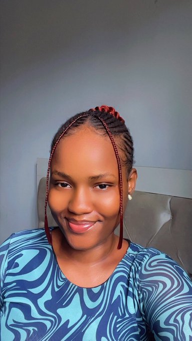 The image features a woman with red braids wearing a blue shirt. She has a smile on her face as she poses for the camera, which appears to be part of a social media platform or website. The caption provided suggests that this photo is related to a ritual or event, possibly an online gathering or celebration.