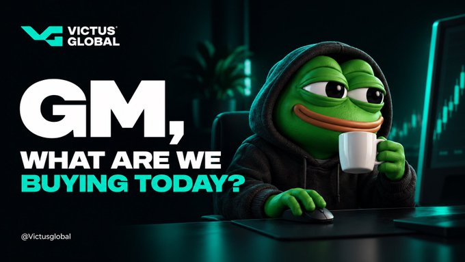 A meme featuring the Pepe frog character wearing a dark hoodie holding a coffee mug, with the 'VICTUS GLOBAL' logo and text reading 'GM, WHAT ARE WE BUYING TODAY?'