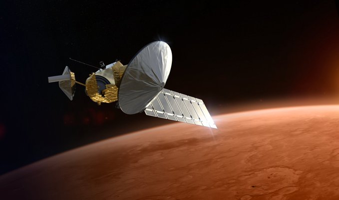 An artist's rendering of a spacecraft with a large dish antenna and solar panels orbiting above Mars, illustrating the type of satellite communication relay that could replace the aging orbiters currently serving the red planet. The image visually supports the post's discussion about a $700 million Mars "base station" contract and the need for upgraded data transmission infrastructure to support future probes.