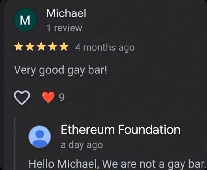 A 5-star Google review from "Michael" describes the venue as a "Very good gay bar!" with 9 likes, prompting a reply from "Ethereum Foundation" stating, "Hello Michael, We are not a gay bar." The humor fits a "Gm" (good morning) crypto post by having the Ethereum Foundation awkwardly correct a misidentified review about its brand.