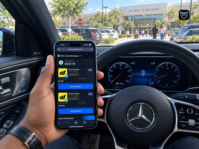 A person holds a smartphone inside a Mercedes-Benz displaying the app.virtualasset.com website showing BWA Yield Strategies with portfolio values, while parked at The Mall at Millenia with a stop sign visible outside.