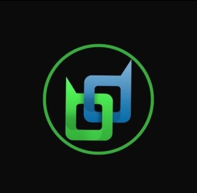 A circular logo on a black background featuring interlocking green and blue geometric shapes resembling stylized speech bubbles or letters.