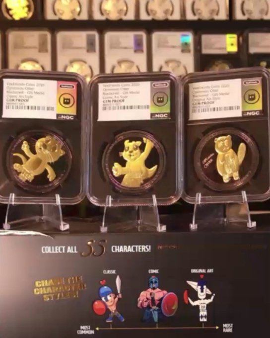 Three graded commemorative gold coins featuring Nintendo characters (Toad, Pikachu, and Meowth) in NGC slabs, with a display showing 'COLLECT ALL 55 CHARACTERS!'
