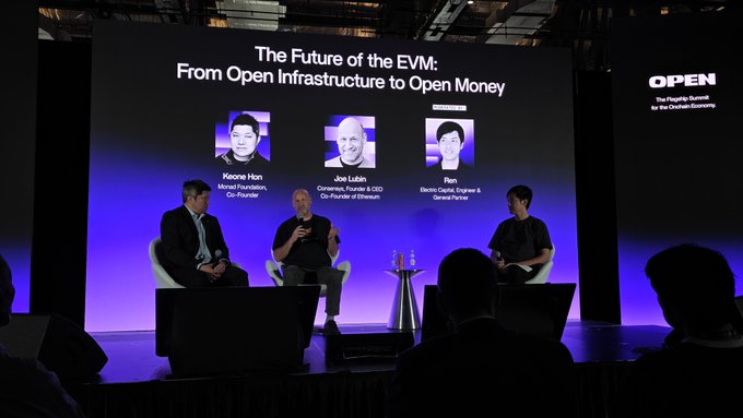 A panel discussion on stage titled 'The Future of the EVM: From Open Infrastructure to Open Money' featuring Keone Hon, Joe Lubin, and Zon, at an OPEN summit event.
