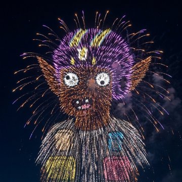 A vibrant fireworks-style digital illustration of a whimsical creature with wild purple hair, large eyes, and pointed ears against a dark night sky.