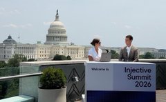 Two presenters stand at a "Welcome to Inflective Summit 2026" podium on a rooftop with the U.S. Capitol dome in the background, as Galaxy (ticker $GLXY) delivers insights on digital assets and institutional on-chain finance at the Injective Summit.