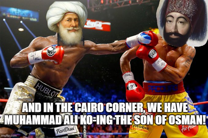 A comedic edited boxing image showing a fighter with an Osama bin Laden face in the yellow corner being punched by a fighter with a bearded face in the white corner, captioned 'AND IN THE CAIRO CORNER, WE HAVE MUHAMMAD ALI KO-ING THE SON OF OSMAN!'.
