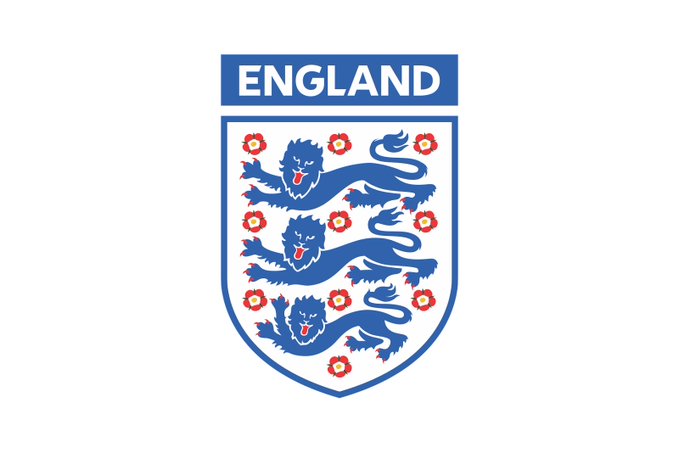 The official England national football team crest featuring three blue lions passant guardant surrounded by red Tudor roses on a white shield.