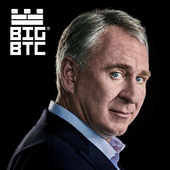 A serious-looking older man in a dark suit is shown in profile against a black background, with a 'BIG BTC' logo visible in the corner.