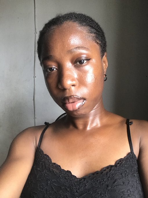 A woman with a glowing, dewy complexion poses in a black lace top for a morning selfie, her serene expression matching the post's sleepy greeting to her mutuals. The image visually supports the caption by capturing that just-woke-up radiance as she declares her readiness to position for $RIVER S5.