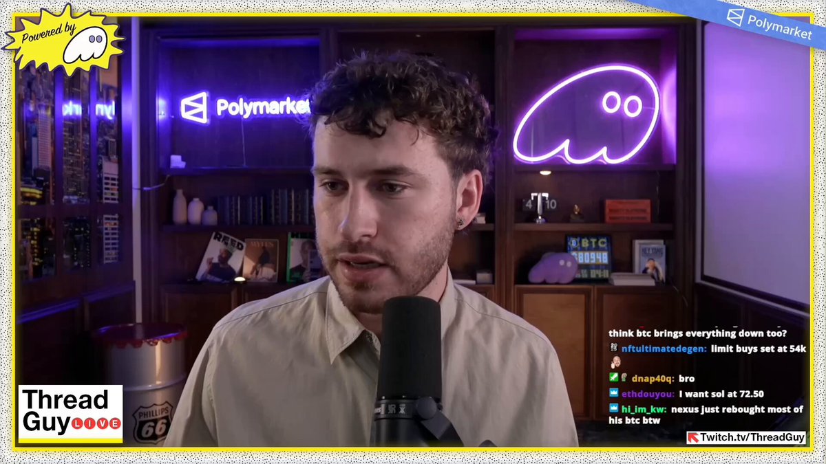 The image shows a man wearing a beige shirt, standing behind a microphone while talking into it. The background features a bookshelf filled with various items such as books and a clock. A neon sign can also be seen in the scene. The text on the image reads "Thread Guy reveals he listened to the 2002 Light x UpOnly podcast and says it sounds identical to now".