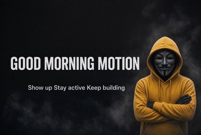 Motivational graphic featuring a hooded figure in a yellow hoodie wearing an Anonymous mask, with the text 'GOOD MORNING MOTION - Show up Stay active Keep building.'