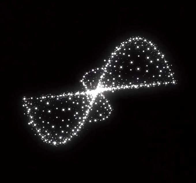 The image features a black background with white dots scattered throughout, creating an abstract pattern that resembles a starry night sky or a galaxy. The dots are positioned at various points across the frame, giving the impression of a vast expanse of space filled with countless stars. The image does not contain any discernible text and is devoid of any other objects or elements, making it a simple yet striking visual representation of the Bitcoin debate.