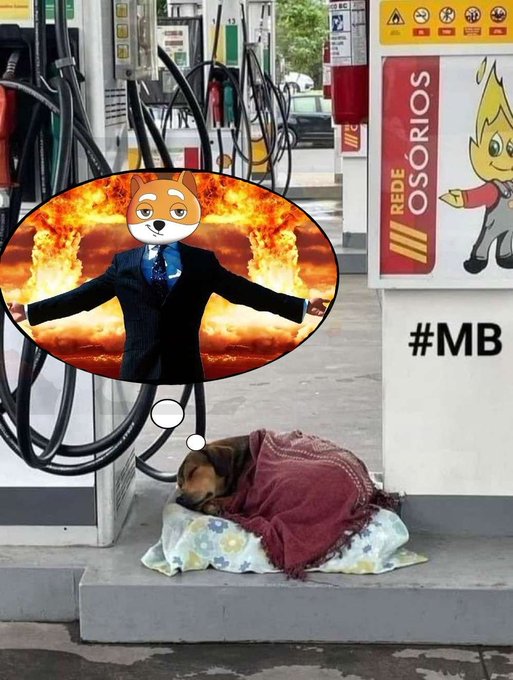 A dog sleeping under a blanket at a gas station, with a thought bubble showing a dog-headed figure in a suit against a fiery explosion background, with '#MB' text on the right.