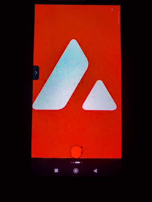 A mobile phone screen displaying the Artlist app's loading or splash screen, featuring a stylized white 'A' logo on a vibrant red background.