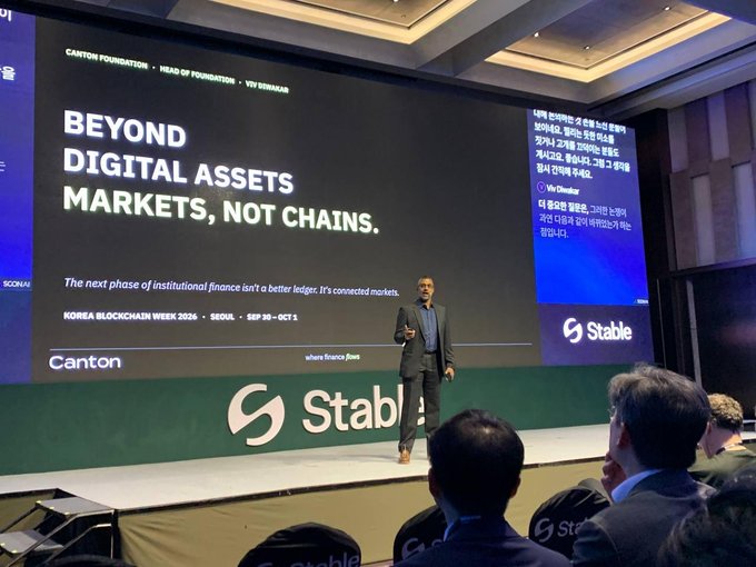 A presentation at Korea Blockchain Week 2026 in Seoul (Sep 30 - Oct 1) featuring the Canton Foundation with the headline 'BEYOND DIGITAL ASSETS MARKETS, NOT CHAINS' on a large screen behind a speaker, sponsored by Stable.
