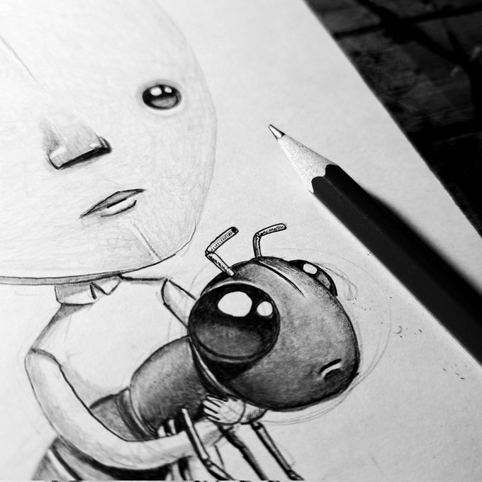 The image features a black and white sketch of a person holding a cartoon insect, possibly a bee or wasp, with a pencil next to it. The pencil appears to be sharpened, indicating that someone has been working on this drawing for some time. The background is blurred, but the focus remains on the art piece in front of us.