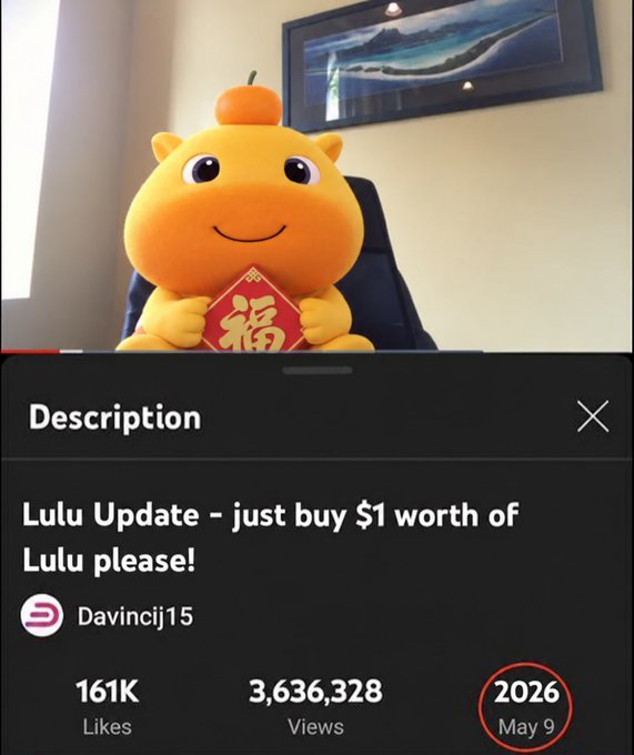 A video or social media post featuring a yellow cartoon cow-like character holding a red diamond with '福' (fortune) on it; the caption reads 'Lulu Update – just buy $1 worth of Lulu please!' by Davincij15, with 161K Likes and 3,636,328 Views.