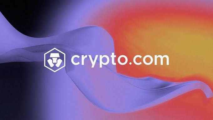 Crypto.com logo displayed against an abstract background of flowing purple, blue, and orange gradients.
