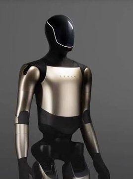 A futuristic humanoid robot with a sleek black and silver body and a glossy black visor stands against a plain grey background.
