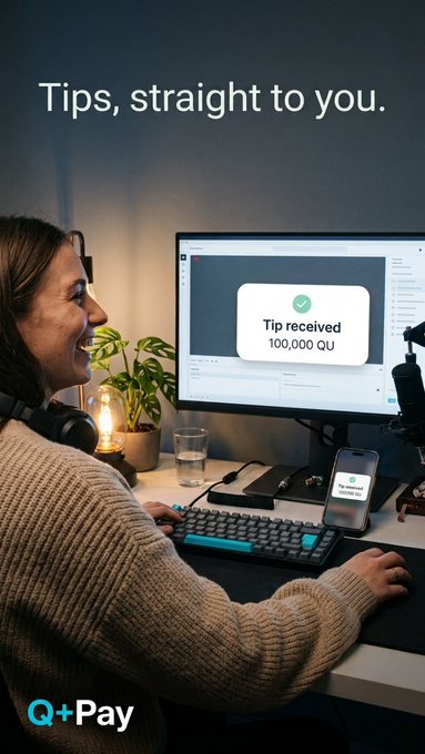 A woman at a desk smiles as she receives a notification of a tip on her computer screen, with text reading 'Tips, straight to you.' and 'Tip received 100,000 QU' from Q+Pay.