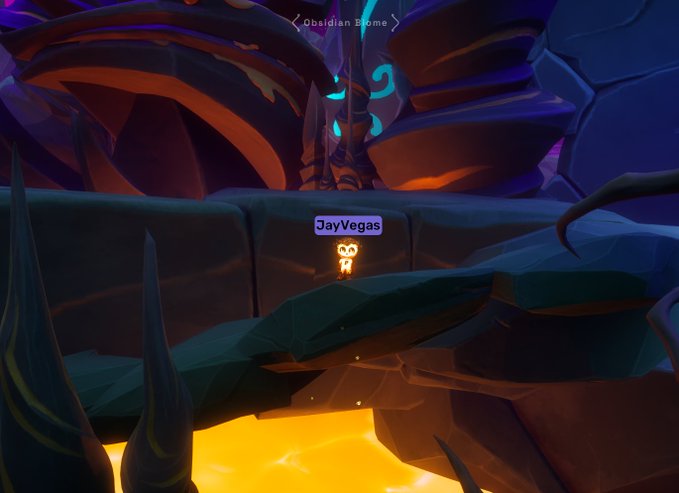 A character named "JayVegas" stands in a dark, otherworldly environment near a glowing "Obsidian Biome" landmark, surrounded by rocky terrain and a glowing orange pool below. The image aligns with the post's promotion of the @OthersideMeta and @OtherGamesXYZ platforms, showcasing the immersive, fantasy-style gameplay world featured in the metaverse experience.