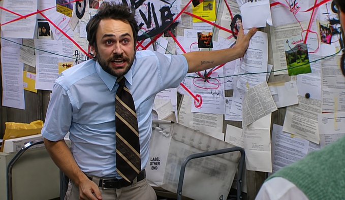 A man in a blue shirt and striped tie gestures dramatically at a conspiracy-style wall covered in papers, photos, and red string connections, with one note labeled "LABEL OTHER END." The "mad investigator" imagery humorously frames the post's emphatic defense of Phoenix Trade as Solana's best challenger to Hyperliquid in on-chain perpetual futures.