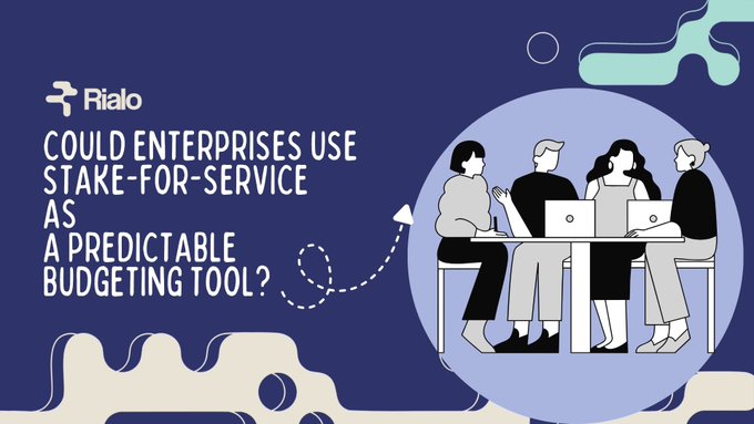 The image shows a group of people sitting around a table with laptops open, suggesting they are working together on a project or discussing ideas. The text at the bottom of the image reads " Could Enterprises Use Stake-for-Service as a Predictable Budgeting Tool? Yes, @RialoHQ this is one of the most practical use cases for Stake-for-Service". This implies that using Stake-for-Service could be beneficial in managing budgets and expenses within an organization.