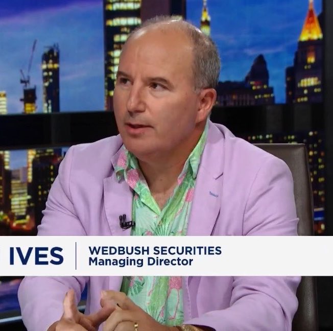 Dan Ives, Managing Director of Wedbush Securities, appears on a financial news program discussing his bullish outlook on $TSLA as his top "disruptive" tech stock pick for 2027, citing robotaxis as a key driver of his optimism.