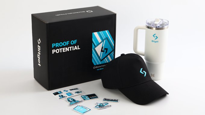 A Bitget 'Proof of Potential' branded merchandise kit including a black cap, white tumbler with handle, and sticker sheet displayed against a branded box.