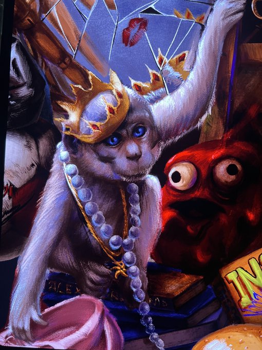 Digital fantasy artwork featuring a hairless cat character wearing a golden crown and beaded necklaces, posed alongside a red monster figure with large eyes.