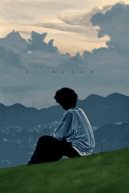 A silhouetted figure sits on a grassy hillside looking out over mountains under a cloudy sunset sky, with the text 'artbyxam' displayed across the middle.