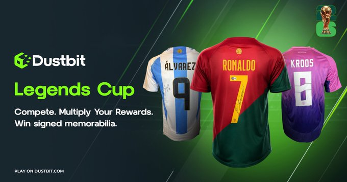 Promotional banner for Dustbit's 'Legends Cup' featuring jerseys of Álvarez (9), Ronaldo (7), and Kroos (8), with text: 'Compete. Multiply Your Rewards. Win signed memorabilia.' and 'PLAY ON DUSTBIT.COM'.