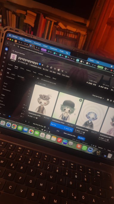 A MacBook displaying the OpenSea NFT marketplace page for collection 'pyopyopyopyo' with various cartoon character NFTs listed for sale, with a couch and bookshelf in the background.