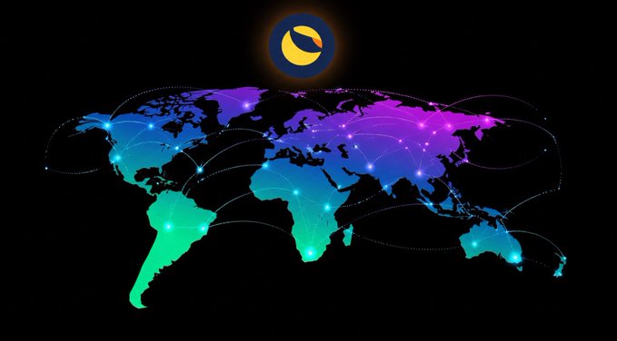 The image features a colorful world map with various countries and their connections, including lines of communication or data trails. The sun is positioned behind the map, casting a glow over the entire scene. The caption above the image reads "Terra Classic: $LUNC Connecting the World Through Decentralization". This suggests that the image might be related to a cryptocurrency called Terra Classic, which uses blockchain technology for decentralization and global connectivity.

The colorful map serves as an eye-catching visual representation of how the world is interconnected through digital communication networks or data trails. The sun's position behind the map further emphasizes this theme by highlighting the idea that information can travel across borders and continents in real-time, just like the lines connecting countries on the map.