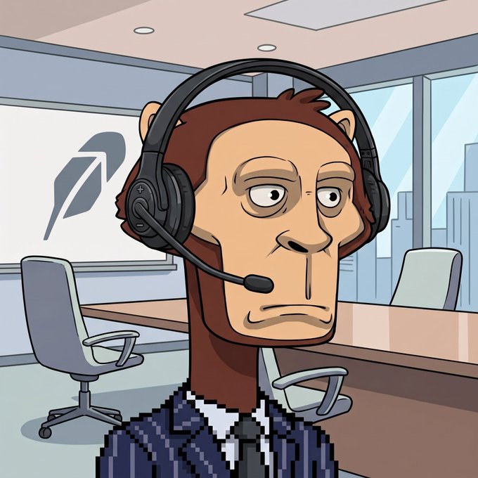 A cartoon illustration of a humanoid monkey character wearing a headset and business suit, standing in an office setting with a logo on the wall behind him.