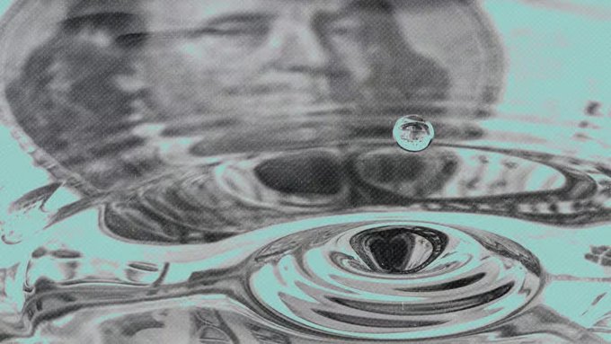 A monochromatic still-life with cyan tint showing water droplets creating concentric waves on a reflective surface.