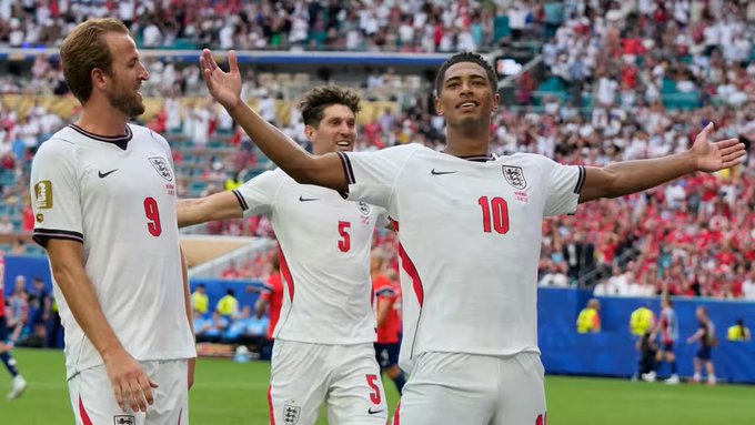 England football players, including #9 (Harry Kane) and #10 (Jude Bellingham), celebrate a goal with arms outstretched in their white jerseys, with Bellingham's outstretched arms mirroring the bullish sentiment in the post about England's victory and the "revival" of Robinhood Chain and ETH.