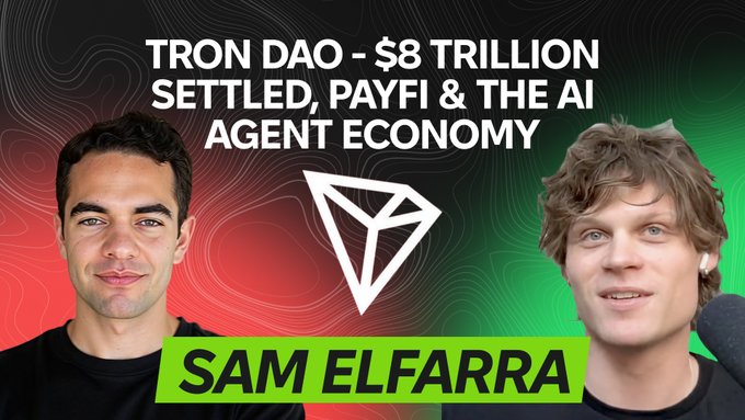 The image features a screenshot of two men smiling at the camera while they are discussing an article about cryptocurrency. The main text states that there was $8 trillion sent through TRON DAO, which was settled using PayFi & the AI Agent Economy. Additionally, a blockchain and stablecoin-related hashtag is also present in the image. There is no discernible text or graphic elements like logos, but it appears to be a promotional post or article discussing cryptocurrency and blockchain technology.