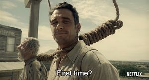 A man with a noose around his neck smiles uncomfortably while holding a chicken, with the Netflix subtitle "First time?" displayed below—jokingly equating the grim situation to the hesitant first experience of "Ledger users" trying out the crypto wallet service.