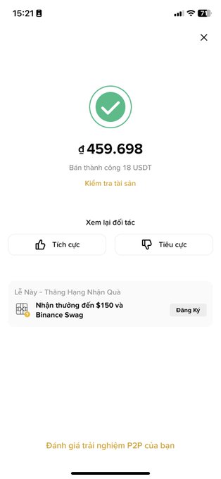 A Binance app screen in Vietnamese showing a completed USDT transaction for 459,698 with options to view partners or assets.
