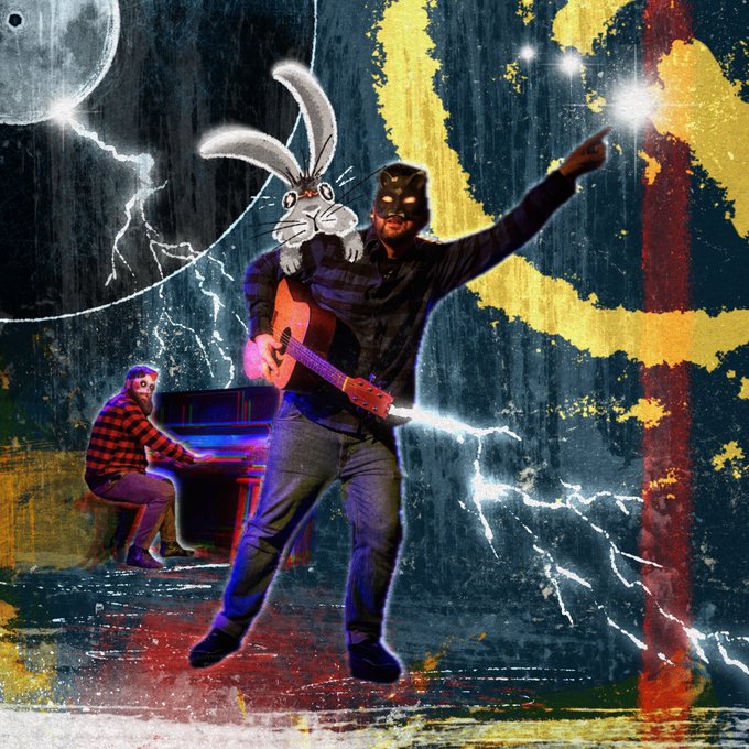 A stylized, chaotic digital artwork featuring a man in a black mask playing a guitar with a Bugs Bunny-like rabbit emerging from the guitar, while another man plays piano in the background against a stormy, lightning-filled backdrop with bold yellow and red abstract shapes.