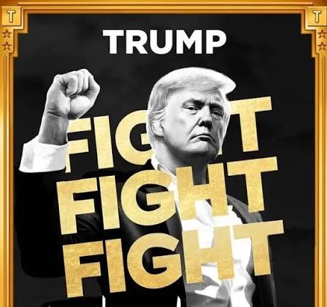 The image is of Donald Trump in a fist fight stance, wearing a formal suit, and is overlaid with the text "FIGHT FIGHT FIGHT" in bold, golden letters against a dark background, suggesting a strong, aggressive theme. This aligns with the accompanying post that indicates a significant financial move by the "TRUMP TEAM" involving the transfer of 2.62 million $TRUMP tokens to OKX, valued at $6.21 million, which is described as the first such move in four weeks. The "FIGHT FIGHT FIGHT" slogan in the image could be interpreted as symbolizing the assertive and combative nature of the financial transaction mentioned in the post.