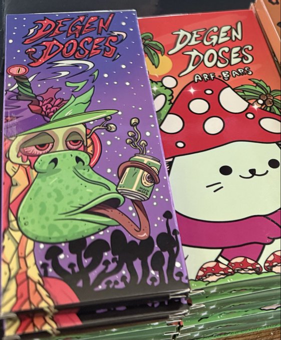 Two colorful boxes of "Degen Doses" branded products are displayed side by side, one labeled "Degen Doses" featuring a psychedelic mushroom character wearing a hat, and the other labeled "Degen Doses Arf Bars" with a cute mushroom character illustration. The post's mention of eating a bar and seeking a "100x" gain humorously ties into the product branding, suggesting these treats are part of the crypto "degen" culture referenced in the packaging.
