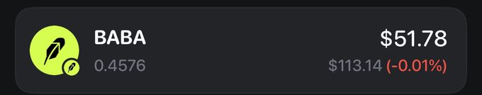 A dark interface widget showing stock information for 'BABA' with a green logo, displaying a price of $51.78, a value of 0.4576, and $113.14 (-0.01%).
