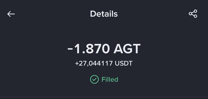 A dark-themed crypto transaction details screen showing a trade of -1.870 AGT for +27.044117 USDT, marked as 'Filled' with a green checkmark.